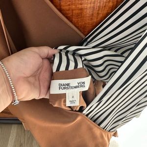 Silk romper by Diane von furstenburg. Never worn. Dressy and fun!!